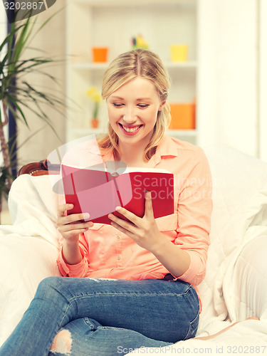 Image of happy and smiling woman with book