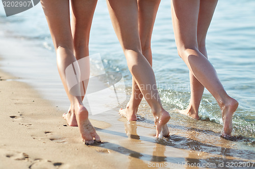 Image of close up of happy young women on beach