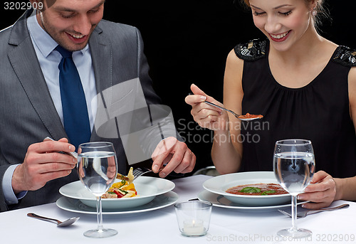 Image of close up of couple eating at restaurant