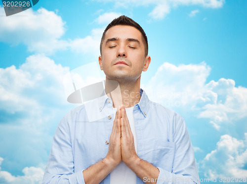 Image of happy man praying