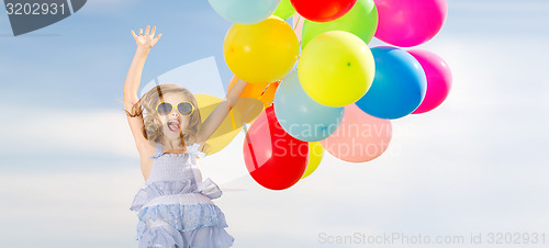 Image of happy jumping girl with colorful balloons