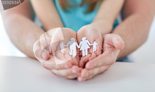 Image of close up of man and girl with cupped hands at home