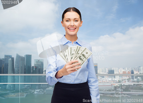 Image of businesswoman with dollar cash money