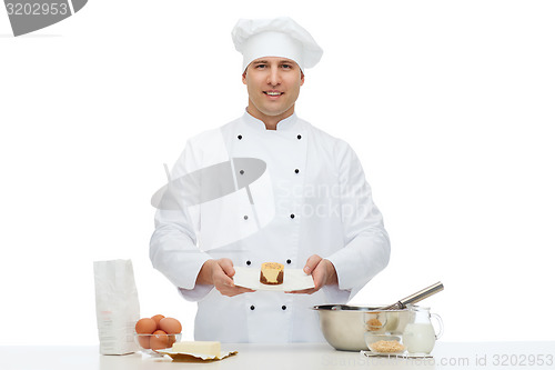 Image of happy male chef cook baking