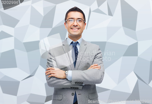 Image of happy smiling businessman in eyeglasses and suit