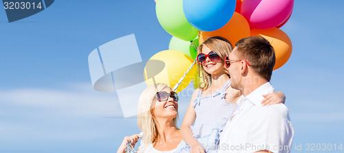 Image of family with colorful balloons