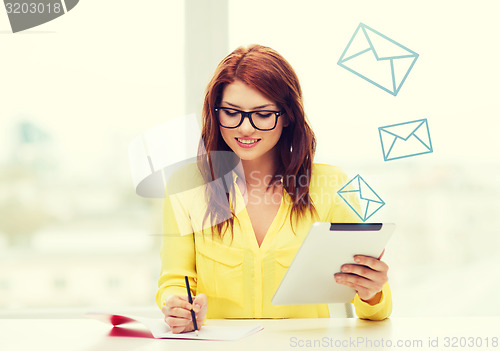 Image of student with tablet pc computer and notebook