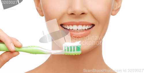 Image of woman with toothbrush