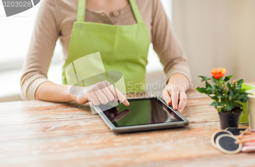 Image of close up of woman or gardener with tablet pc