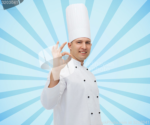 Image of happy male chef cook showing ok sign