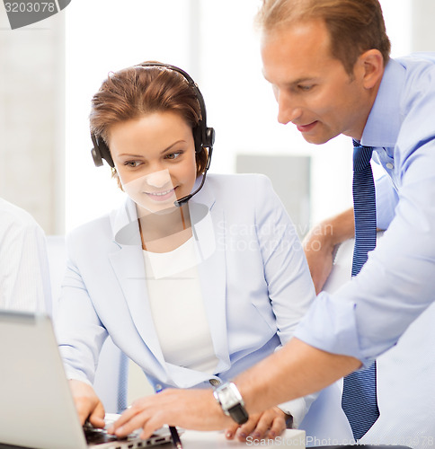 Image of group of people working in call center