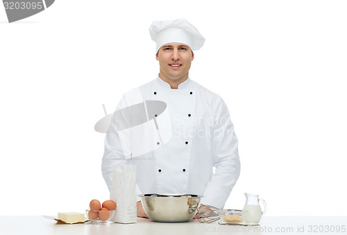 Image of happy male chef cook baking