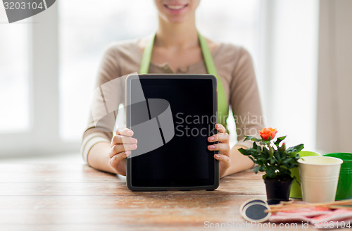 Image of close up of woman or gardener with tablet pc