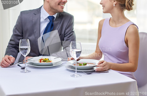 Image of close up of couple talking at restaurant