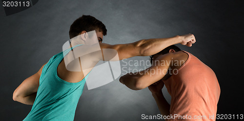 Image of young men wrestling