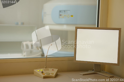 Image of MRI machine and screens