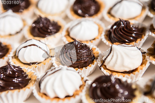 Image of white and black meringue cookies.