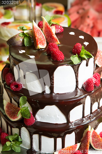 Image of Chocolate cake with figs and raspberries