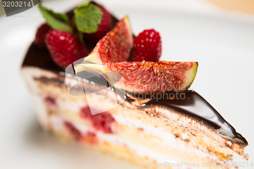 Image of cake with chocolate, fig and raspberry