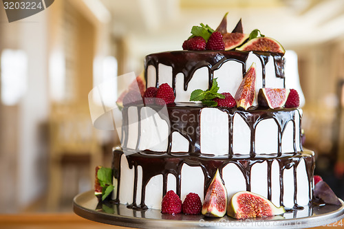 Image of Chocolate cake with figs and raspberries