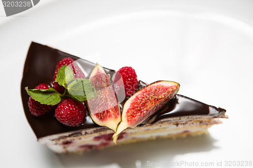 Image of cake with chocolate, fig and raspberry