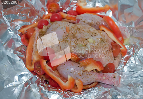 Image of Chicken baked in foil with vegetables