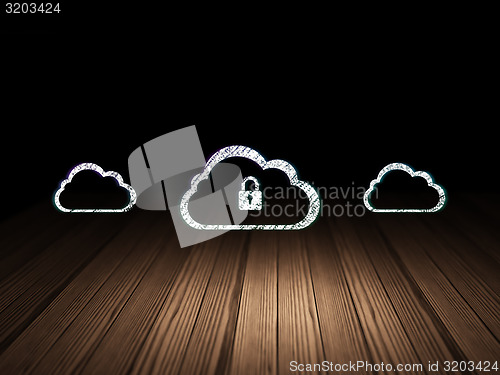 Image of Cloud networking concept: cloud with padlock icon in dark room
