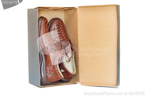 Image of Men\'s shoes in the package on a white background.