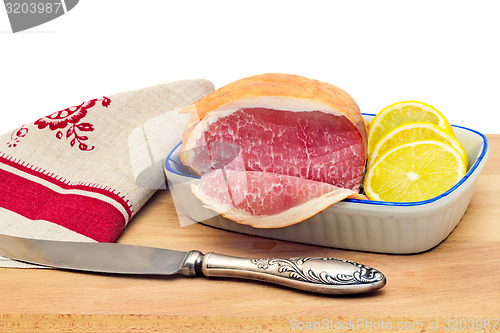 Image of Ham , bread and vegetables on a white background.