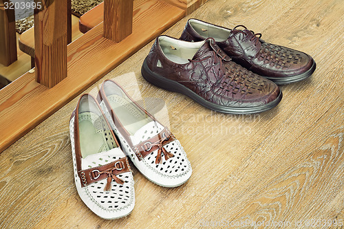 Image of Two pairs of comfortable shoes : for men and for women.