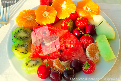 Image of Fruit dessert, diverse fruits and berries.