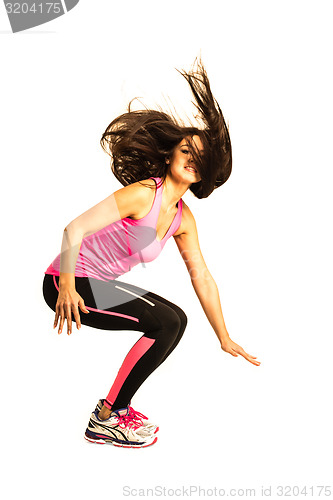 Image of Sportive young woman jumping isolated on white background