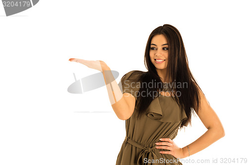 Image of Attractive young woman looking at your product with great joy