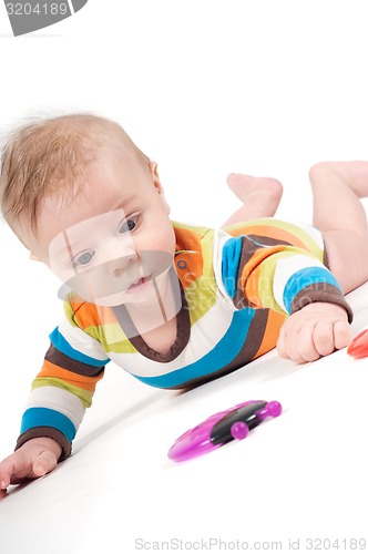 Image of Portrait of cute baby boy with toy