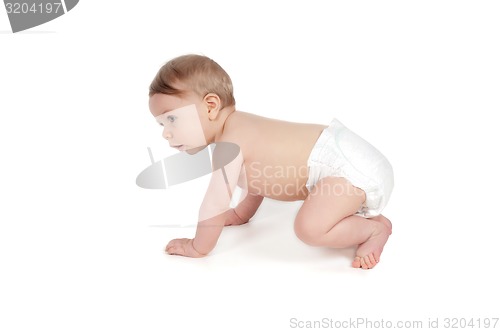 Image of Side view of pretty crawling baby