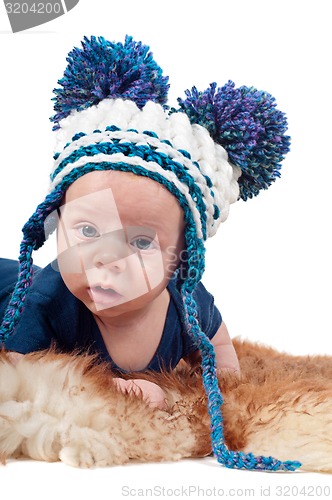 Image of Portrait of adorable baby boy in knitted hat