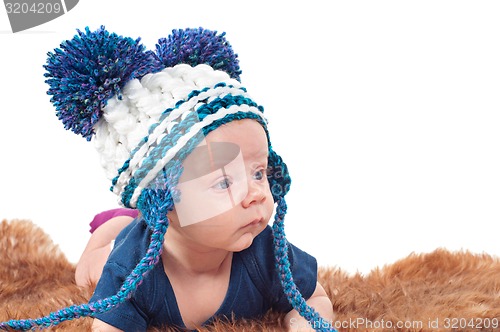 Image of Portrait of adorable baby in knitted hat