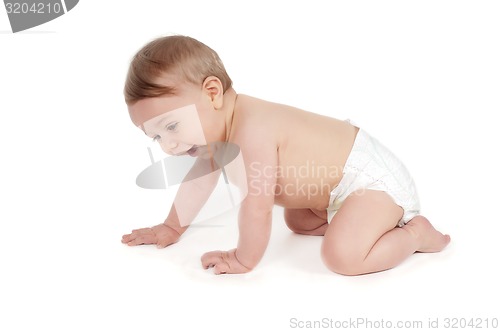 Image of Side view of pretty crawling baby