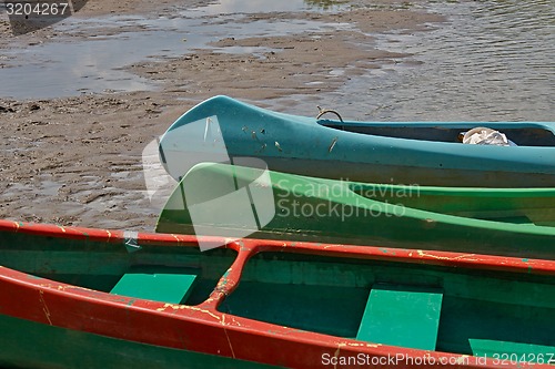 Image of Canoes on the Riverside