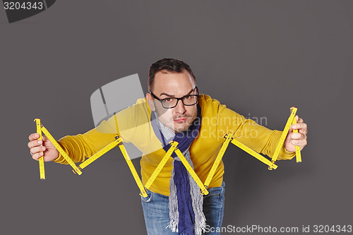 Image of Man showing house frame concept