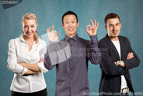 Image of Teamwork and Asian Man Shows OK