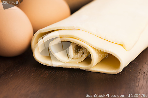 Image of homemade dough on a wooden board 