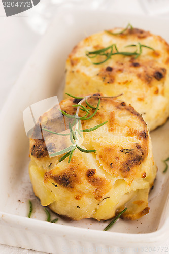 Image of potato gratin with fresh rosemary