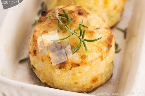 Image of potato gratin with fresh rosemary