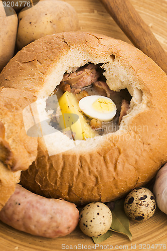 Image of traditional white borscht (zurek) with sausage,egg and mushrooms