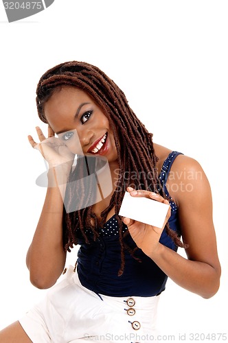 Image of African American lady holding business card.