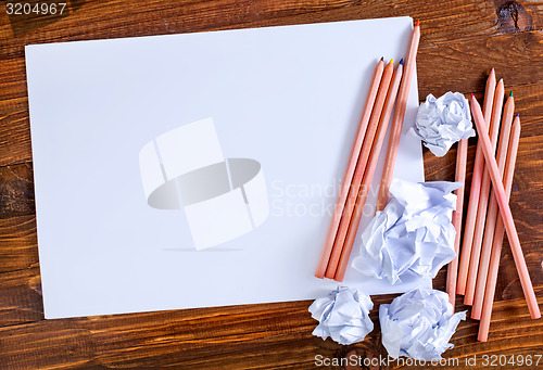 Image of paper on wooden background