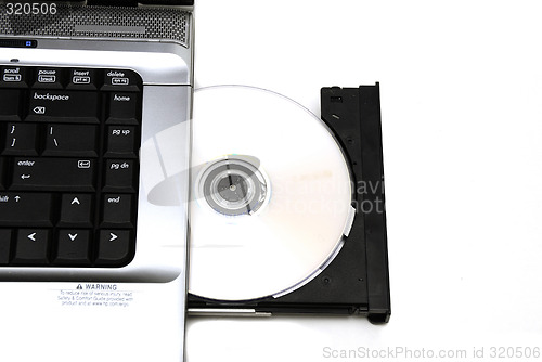 Image of Open laptop CD-ROM drive on a white