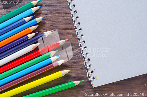 Image of note and pencils