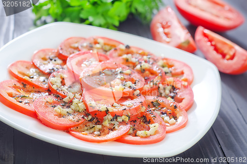 Image of tomato with basil and garlic